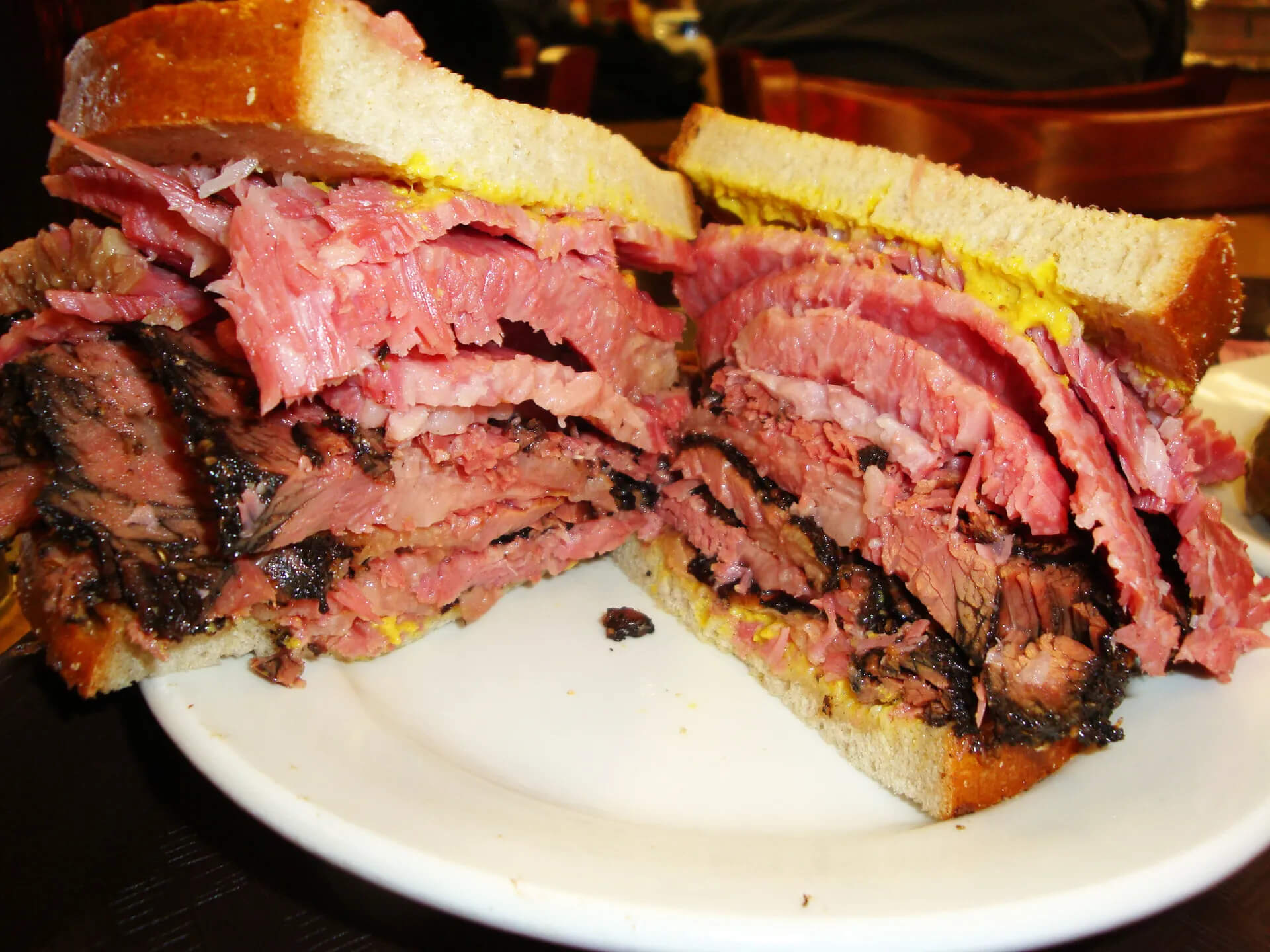 food open late. Katz’s Delicatessen is famous for its thick-cut pastrami sandwich